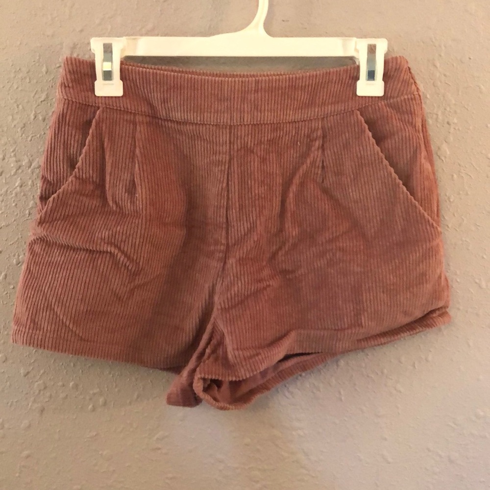 Pink corduroy shorts.